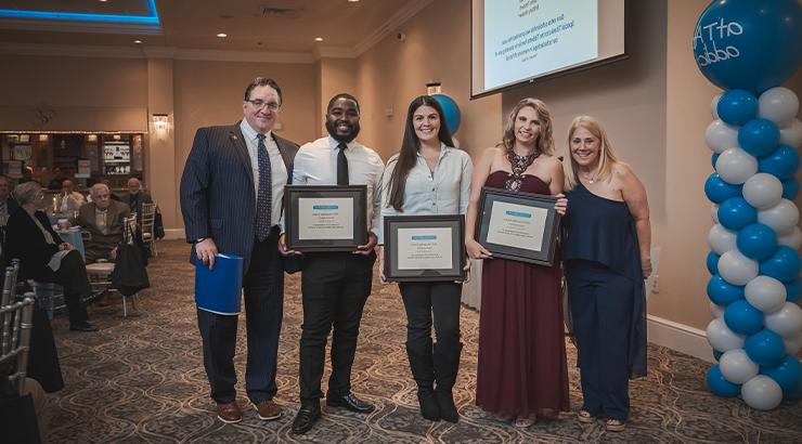 Amanda Chen (center) with fellow scholarship recipients and representatives from atTAcK addiction